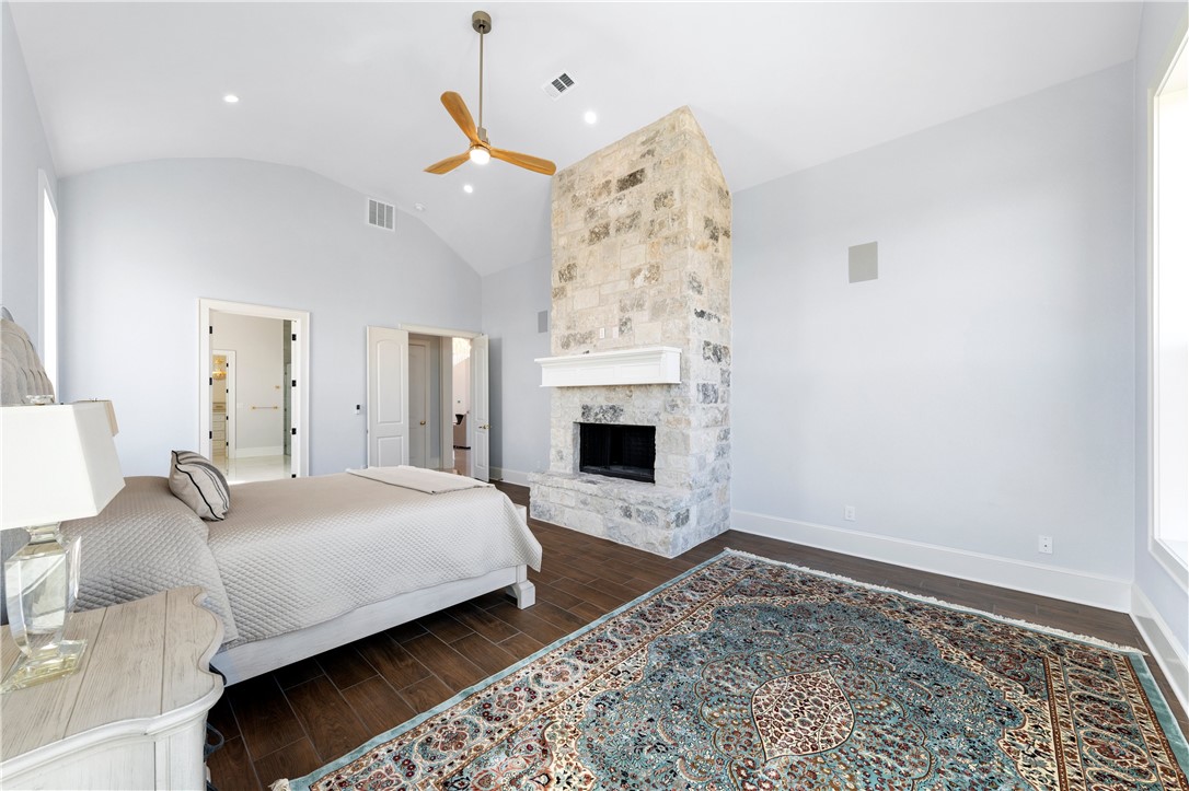 112 Yellow Rose Street Lorena, TX 76655 - Photo 19 of 42 a bedroom with a bed and a fireplace