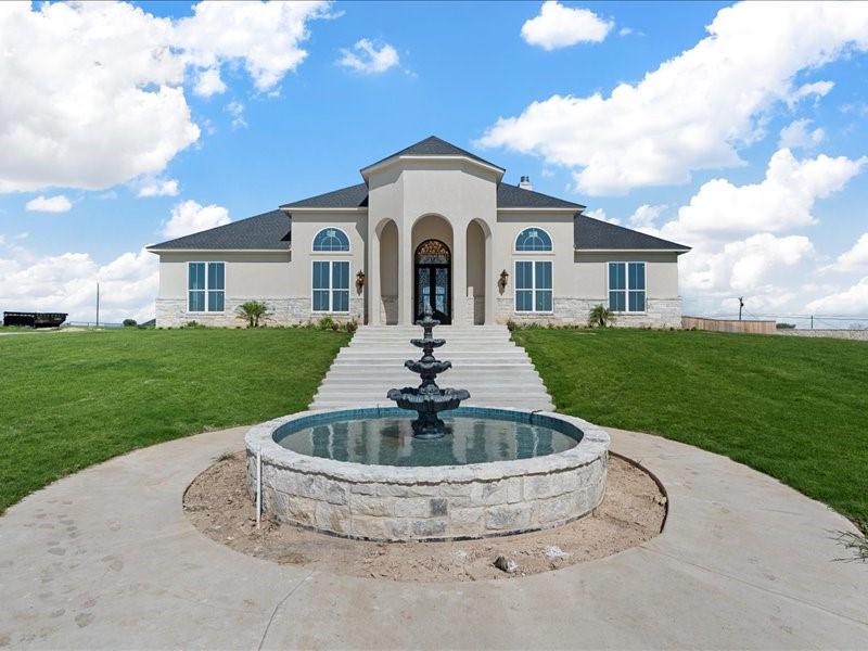 112 Yellow Rose Street Lorena, TX 76655 - Photo 2 of 42 a view of a house with a yard potted plants and large tree