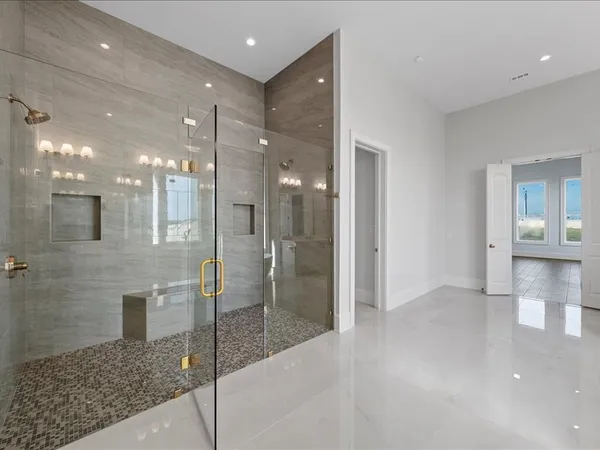 a bathroom with a bathtub and a sink