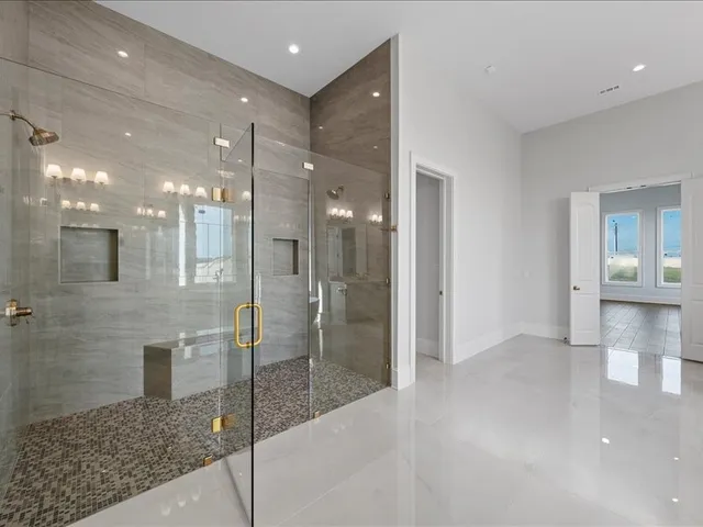 a bathroom with a bathtub and a sink