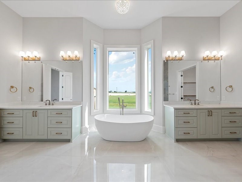112 Yellow Rose Street Lorena, TX 76655 - Photo 23 of 42 a spacious bathroom with a granite countertop tub double vanity sink a mirror a lamp a window and a bathtub