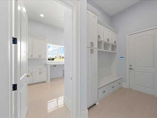 a bathroom with a granite countertop toilet and a sink