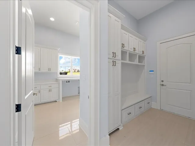 a bathroom with a granite countertop toilet and a sink