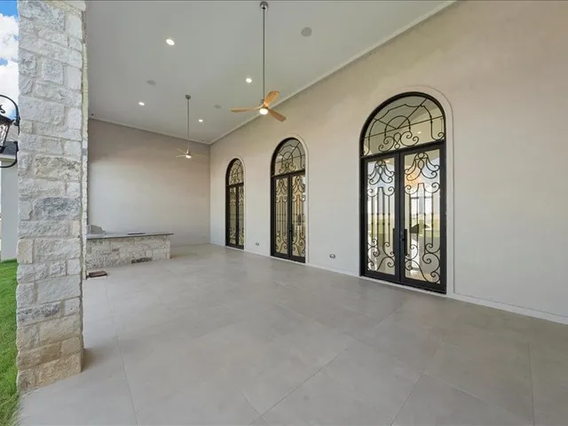 a view of a house with a backyard