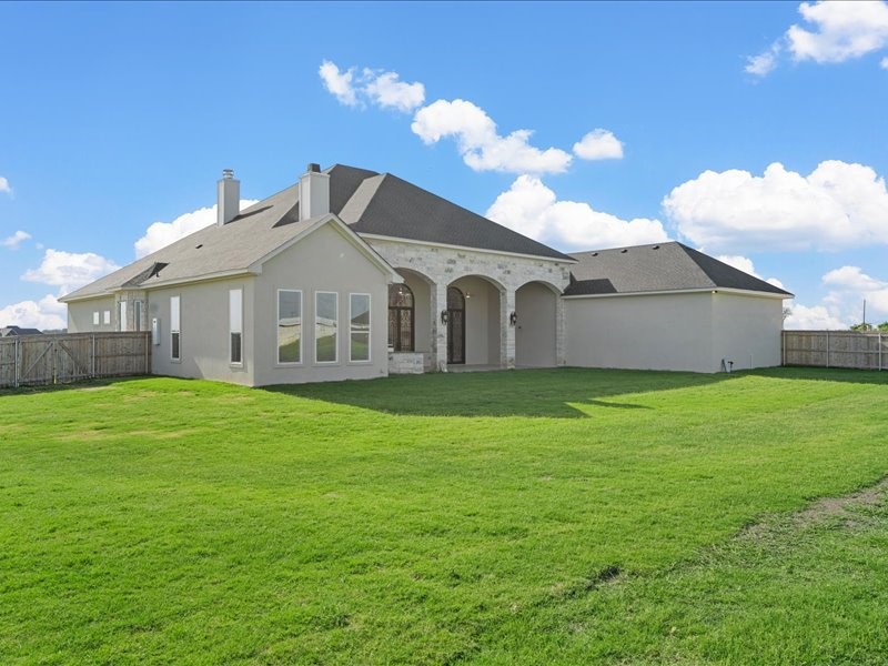 112 Yellow Rose Street Lorena, TX 76655 - Photo 40 of 42 a view of a house with a backyard