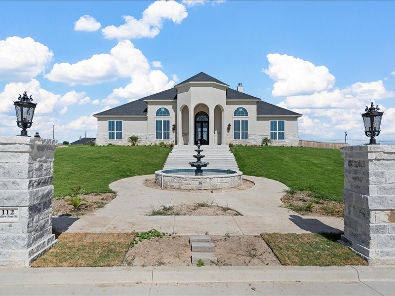 112 Yellow Rose Street Lorena, TX 76655 - Photo 4 of 42 a front view of a house with a yard and garage