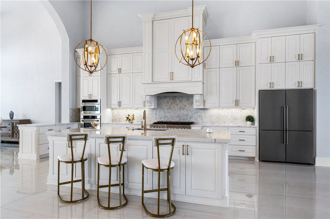 112 Yellow Rose Street Lorena, TX 76655 - Photo 10 of 42 a kitchen with cabinets and chairs