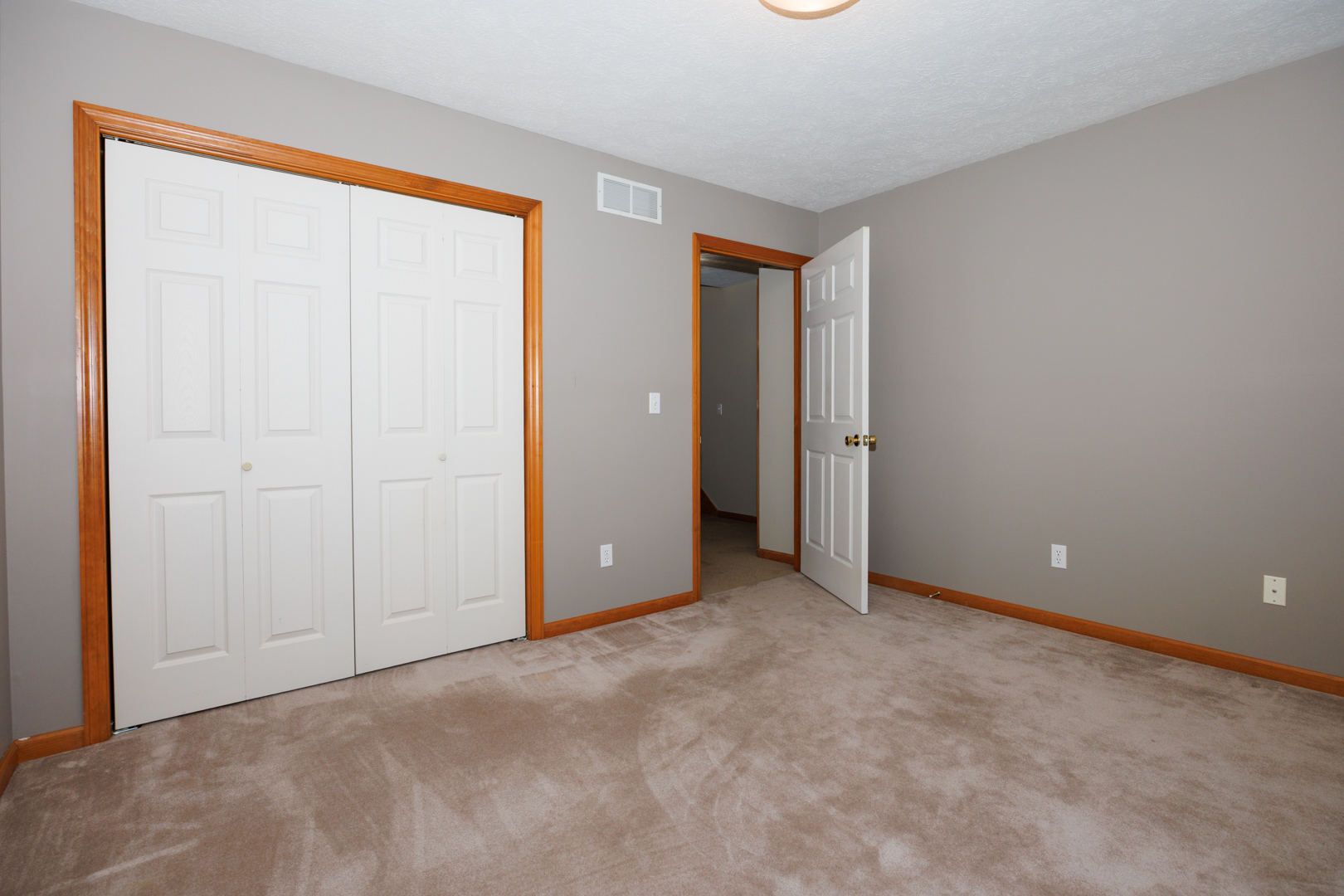 1414 B Tamarack Country Club Trail Normal, IL 61761 - Photo 20 of 48 an empty room with closet and a bathroom