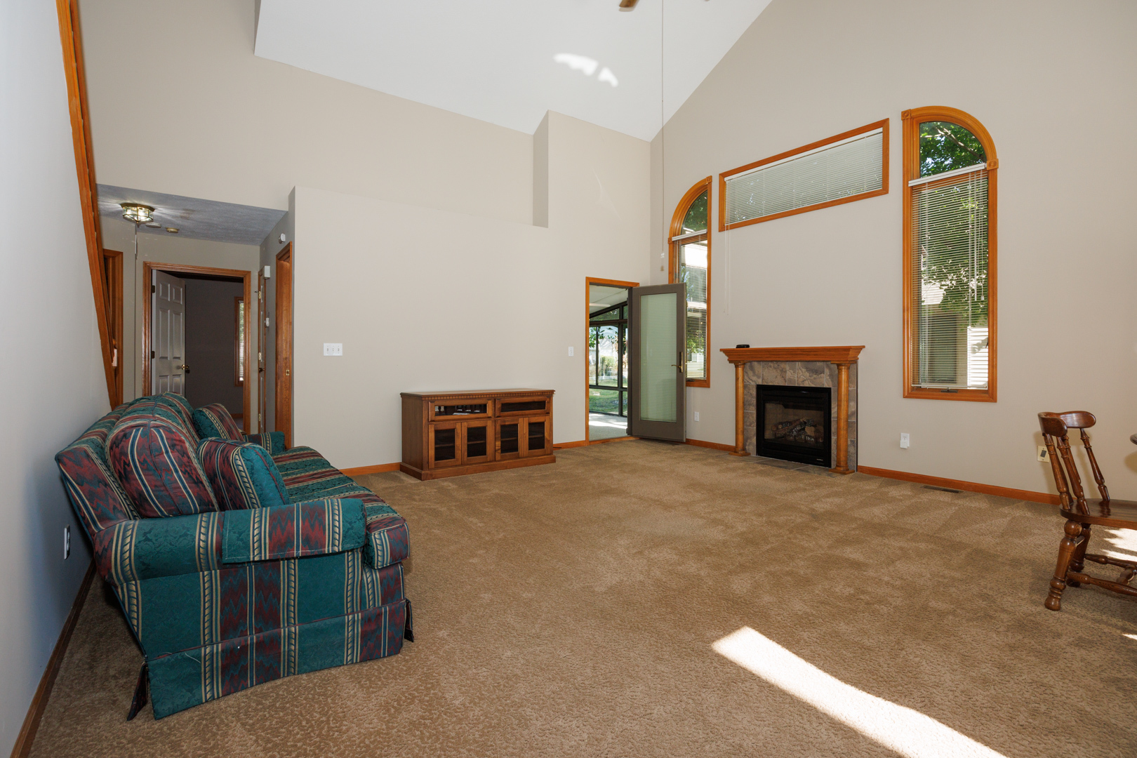 1414 B Tamarack Country Club Trail Normal, IL 61761 - Photo 2 of 48 a living room with furniture rug and fireplace