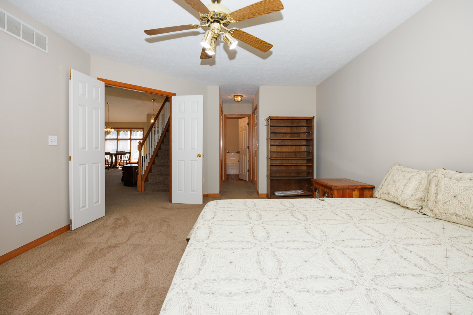 1414 B Tamarack Country Club Trail Normal, IL 61761 - Photo 23 of 48 a bedroom with a bed and a chandelier