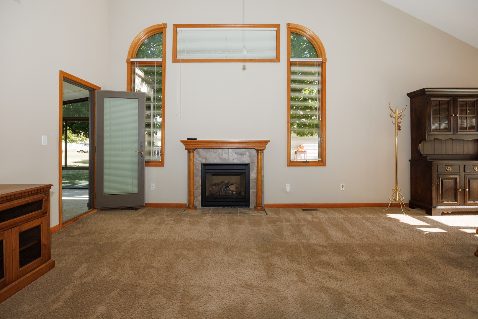 1414 B Tamarack Country Club Trail Normal, IL 61761 - Photo 5 of 48 an empty room with windows and fireplace