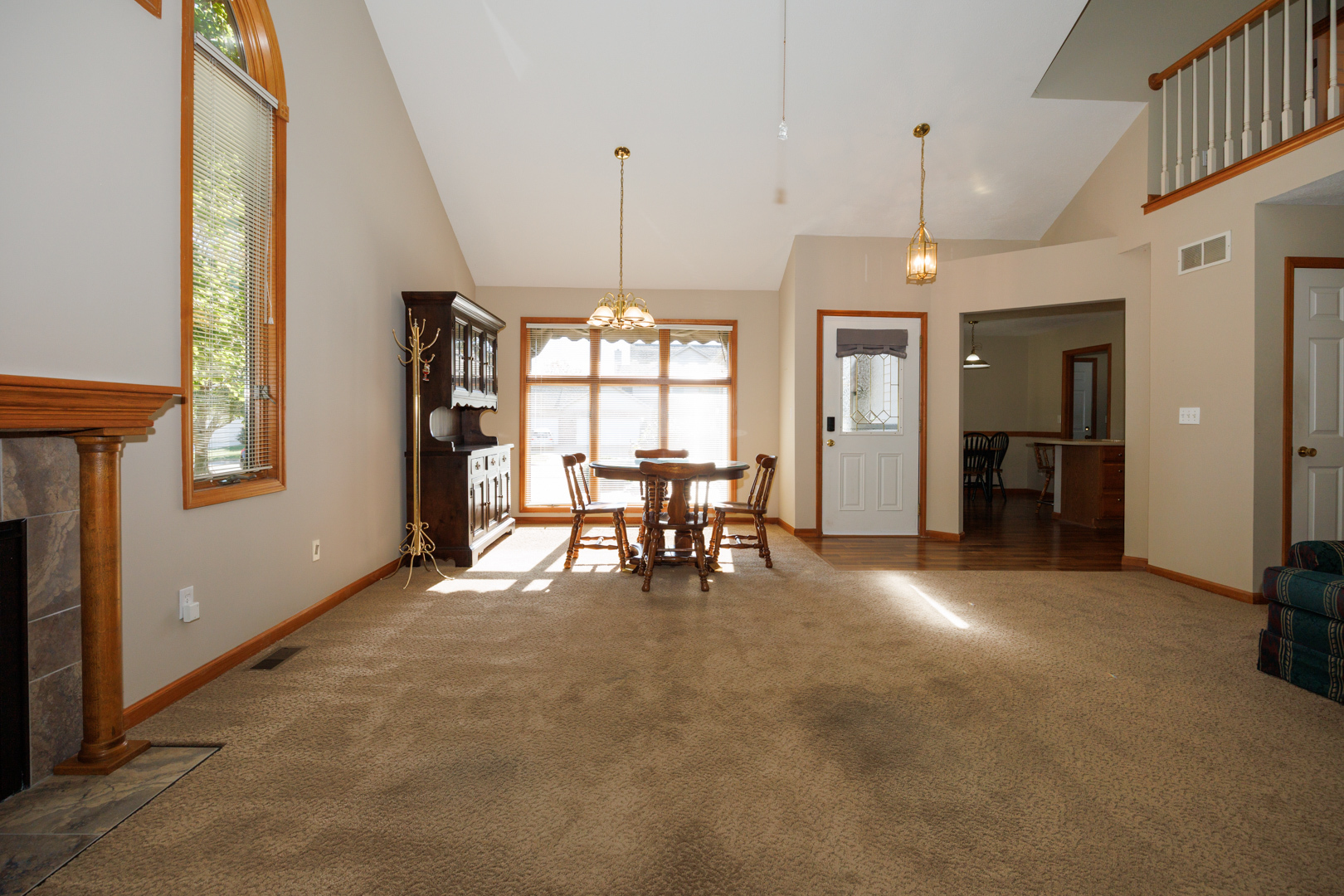 1414 B Tamarack Country Club Trail Normal, IL 61761 - Photo 7 of 48 a view of a room with furniture and a chandelier