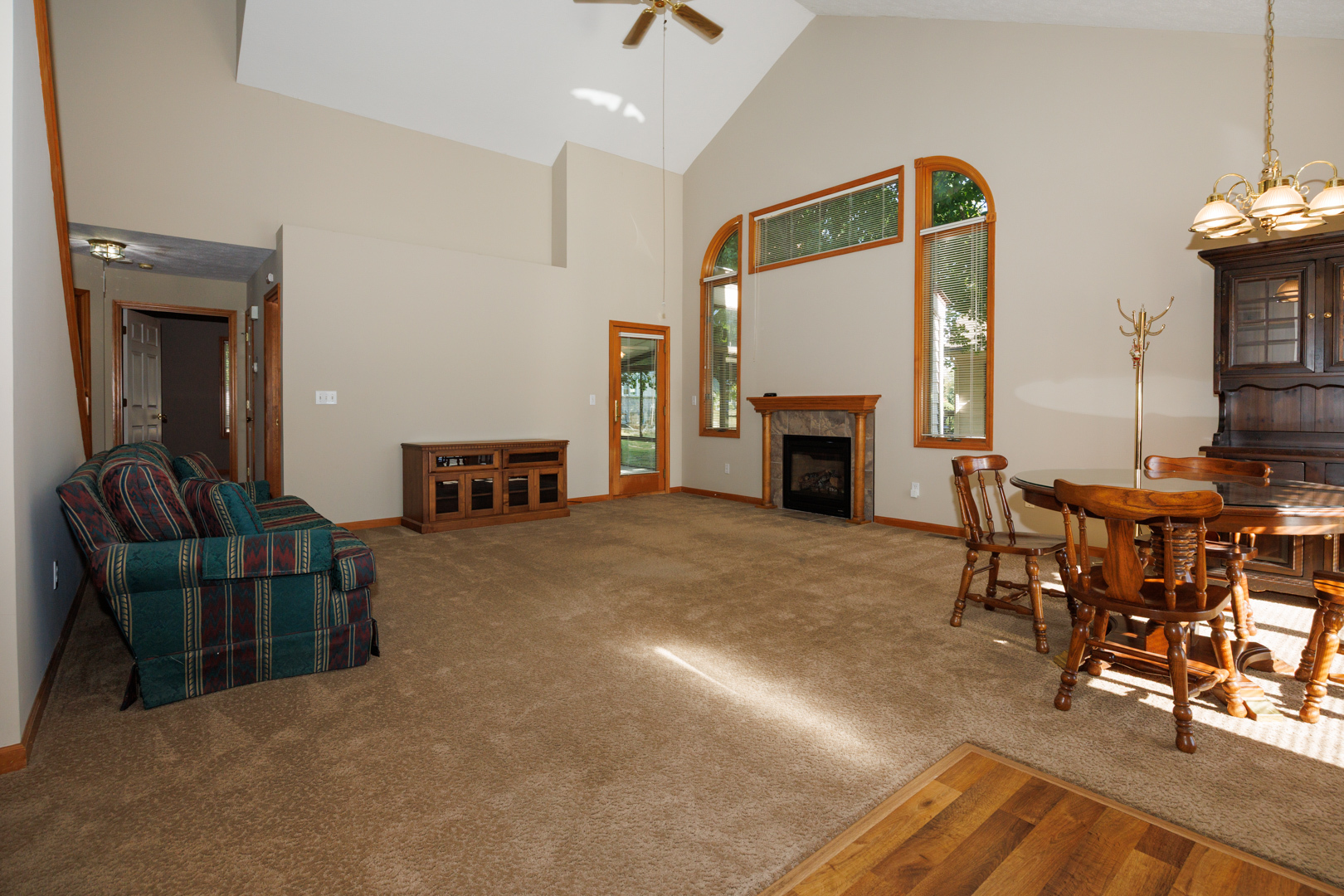1414 B Tamarack Country Club Trail Normal, IL 61761 - Photo 8 of 48 a living room with furniture and a fireplace