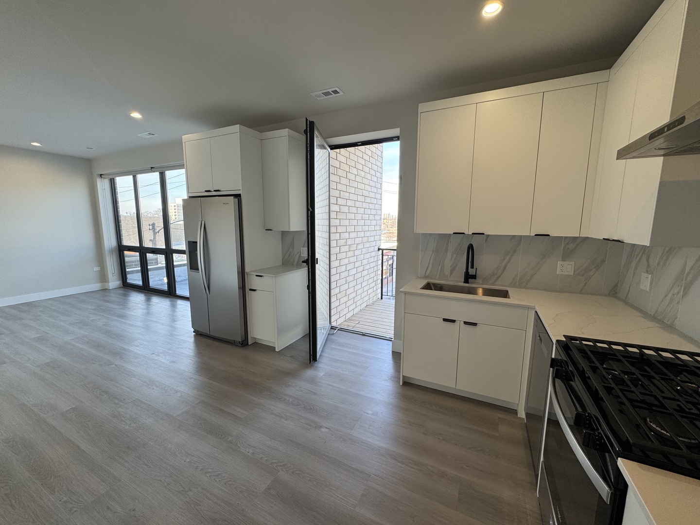 451 East Pershing Road, Unit 301 Chicago, IL 60653 - Photo 6 of 21 a living room with furniture and a wooden floor