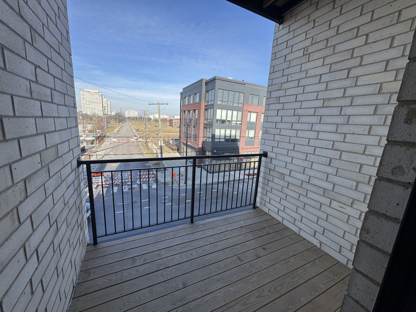451 East Pershing Road, Unit 301 Chicago, IL 60653 - Photo 7 of 21 a view of a balcony with wooden floor