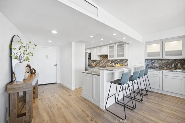 a kitchen with a table and chairs in it