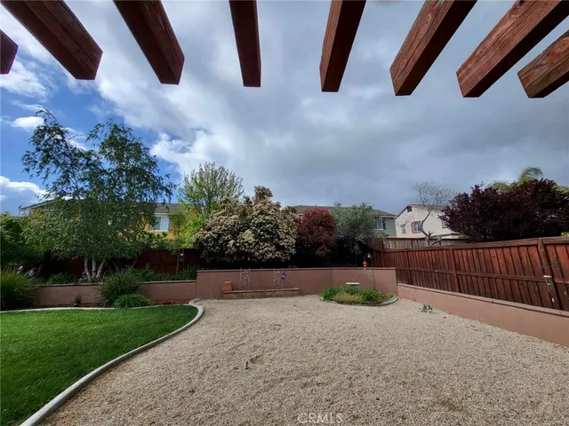 a view of backyard and entertaining space