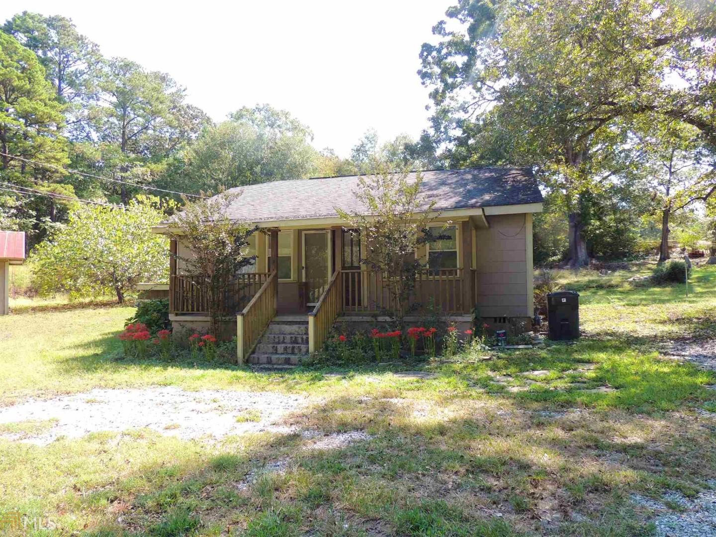 313 Elberton Road Lexington, GA 30648 - Photo 1 of 1 a view of a backyard with a small cabin