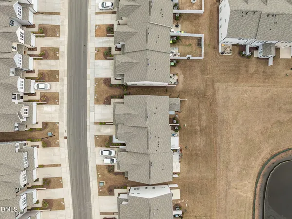 a view of a swimming pool with a yard and lake view