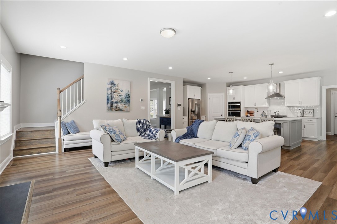 12040 Kenton Ridge Road Ashland, VA 23005 - Photo 23 of 54 Open-concept living space featuring wood-finish fl