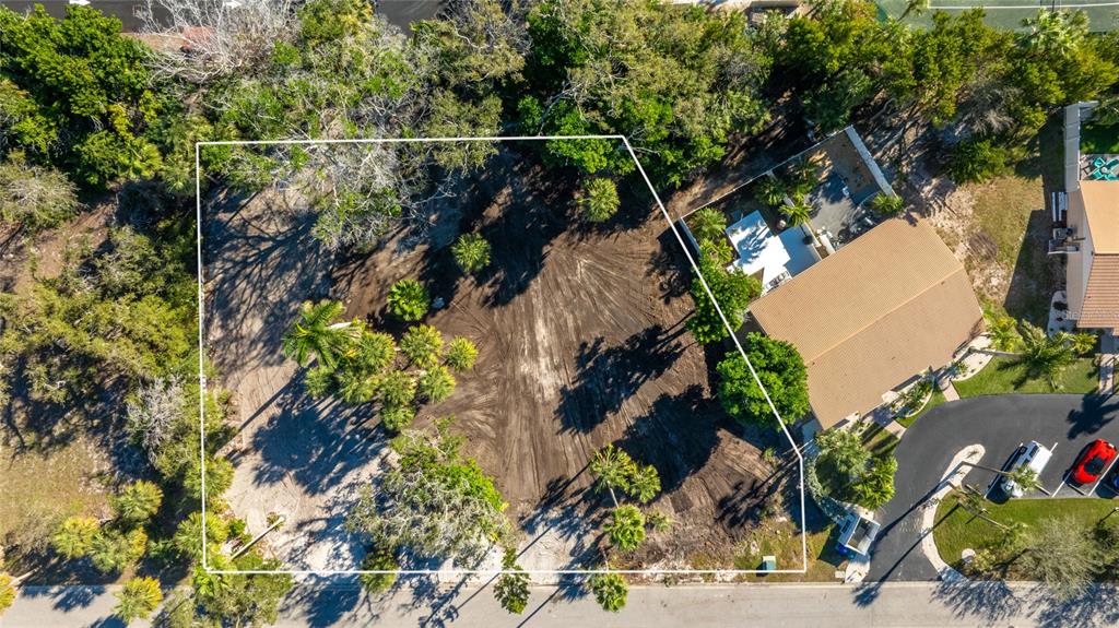 an aerial view of houses with yard