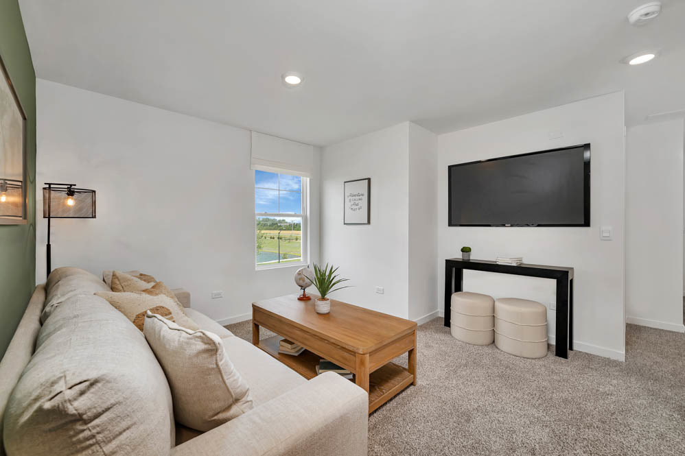 7103 Fair Oaks Road, Unit 37 Racine, WI 53403 - Photo 15 of 21 a living room with furniture and a flat screen tv
