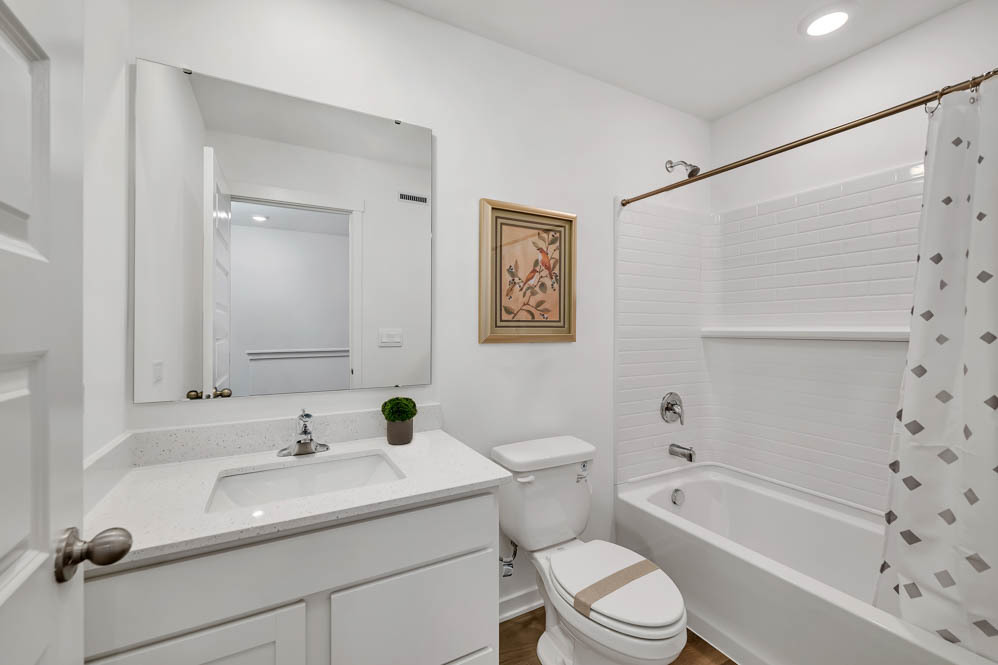 7103 Fair Oaks Road, Unit 37 Racine, WI 53403 - Photo 18 of 21 a bathroom with a sink toilet and shower