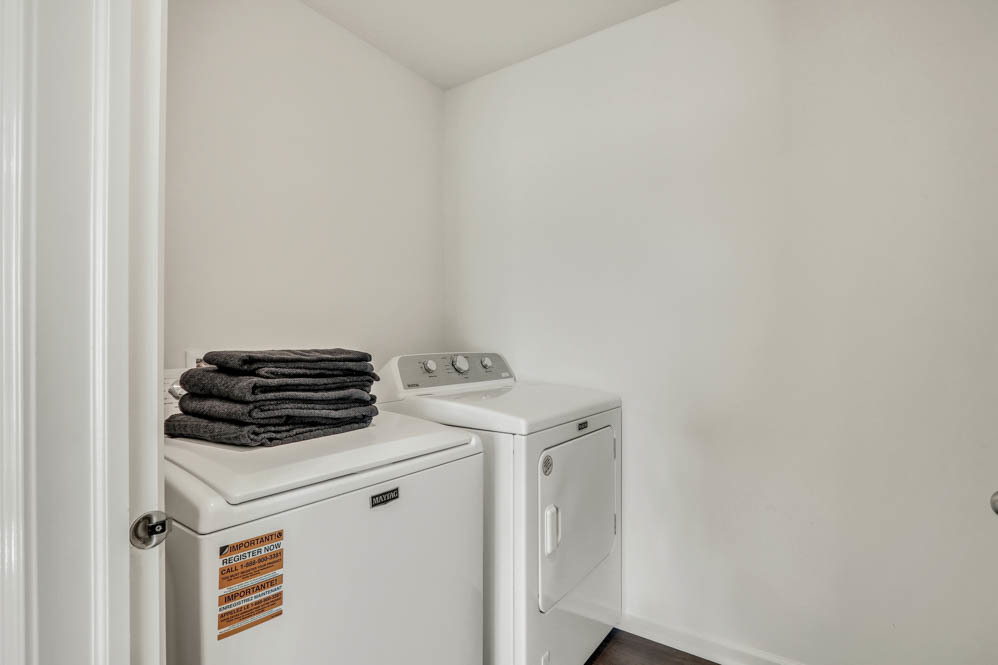 7103 Fair Oaks Road, Unit 37 Racine, WI 53403 - Photo 19 of 21 a view of storage and utility room with washer and dryer