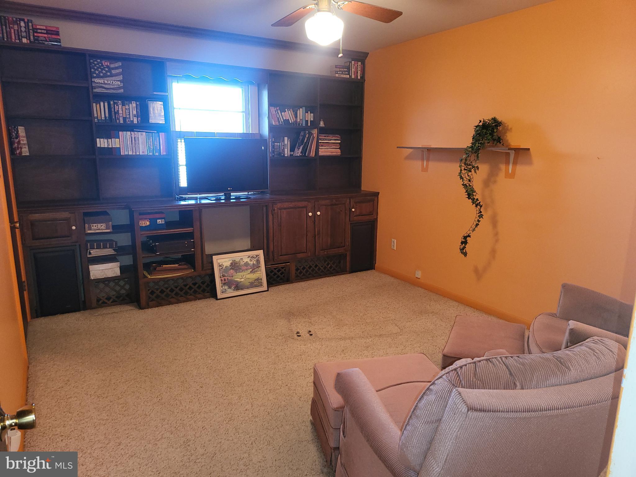 161 Oakhill Road Carlisle, PA 17015 - Photo 13 of 25 a bedroom with a bed and a chandelier