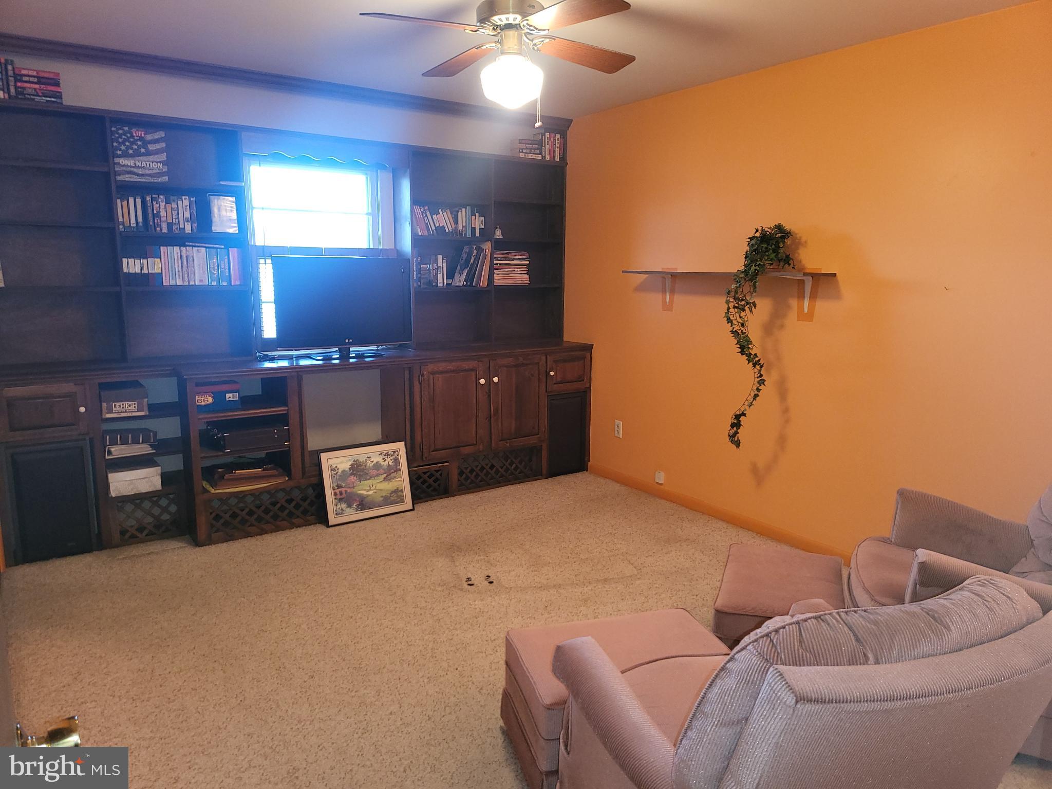 161 Oakhill Road Carlisle, PA 17015 - Photo 7 of 25 a bedroom with a bed and a chandelier