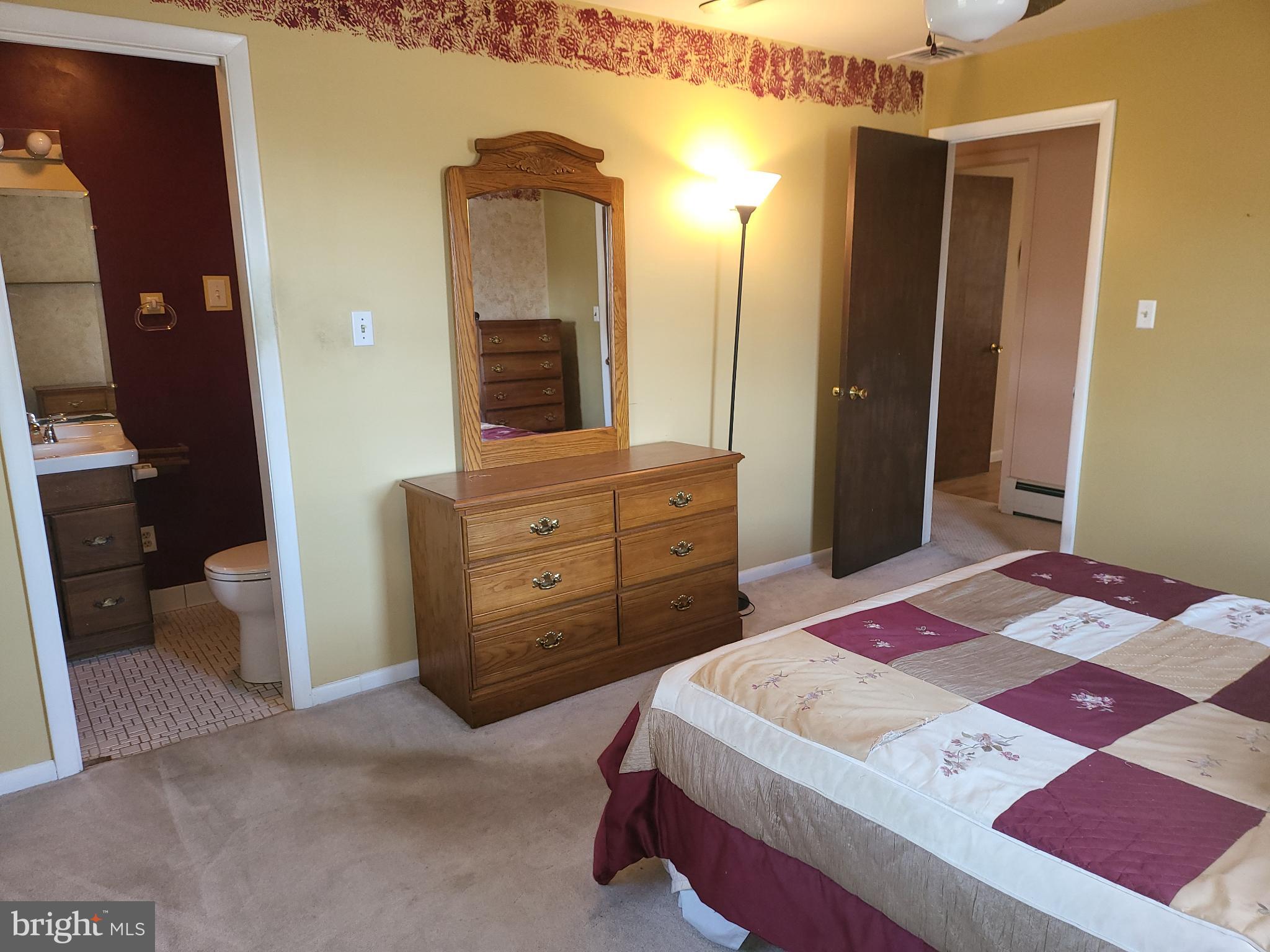 161 Oakhill Road Carlisle, PA 17015 - Photo 9 of 25 a bed room with a bed and a mirror