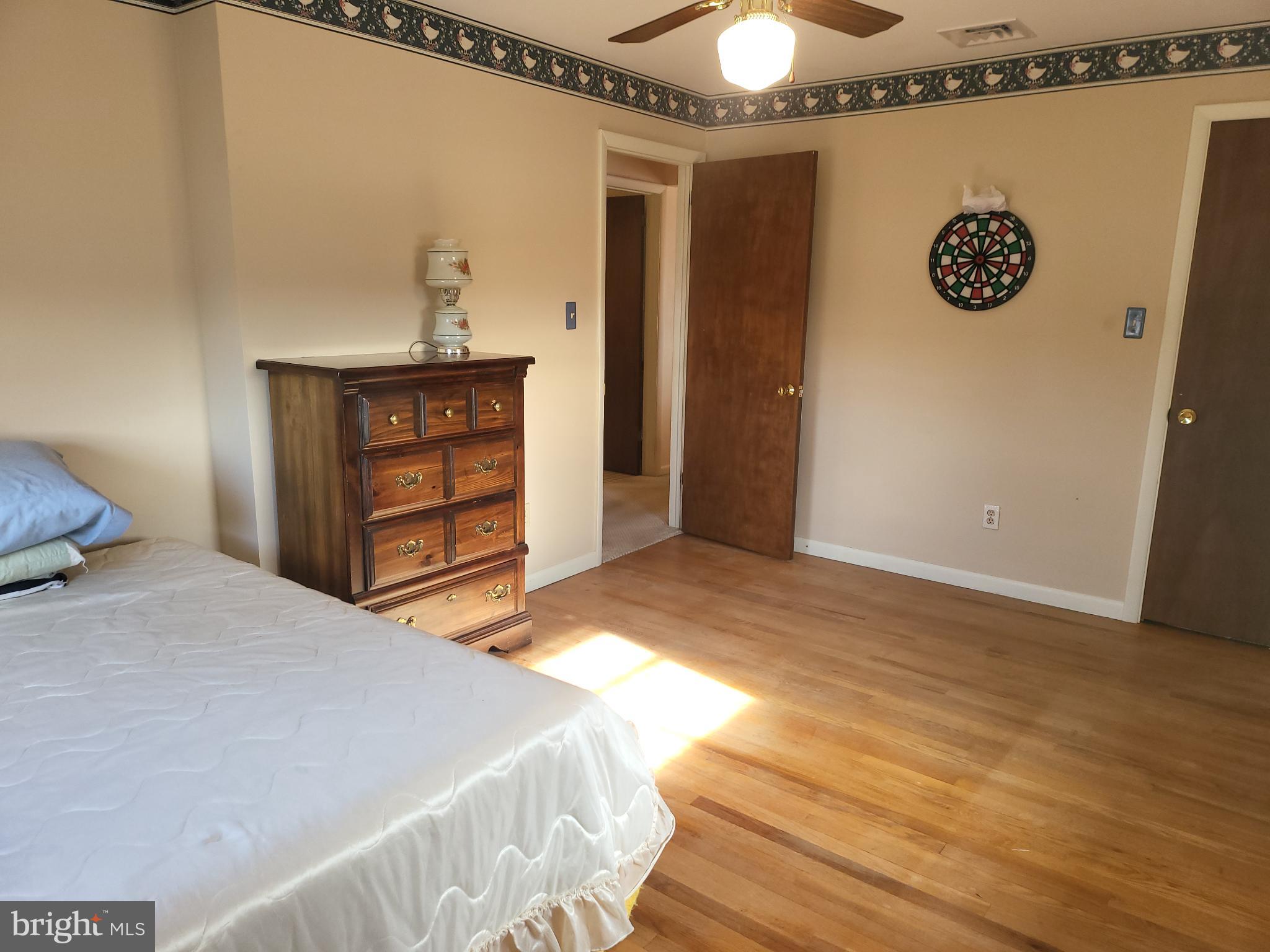 161 Oakhill Road Carlisle, PA 17015 - Photo 10 of 25 a bedroom with a bed and a wall painting