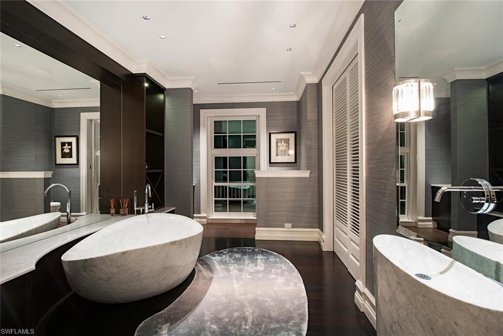 2500 Gordon Drive Naples, FL 34102 - Photo 15 of 25 a living room with furniture a large window and dresser