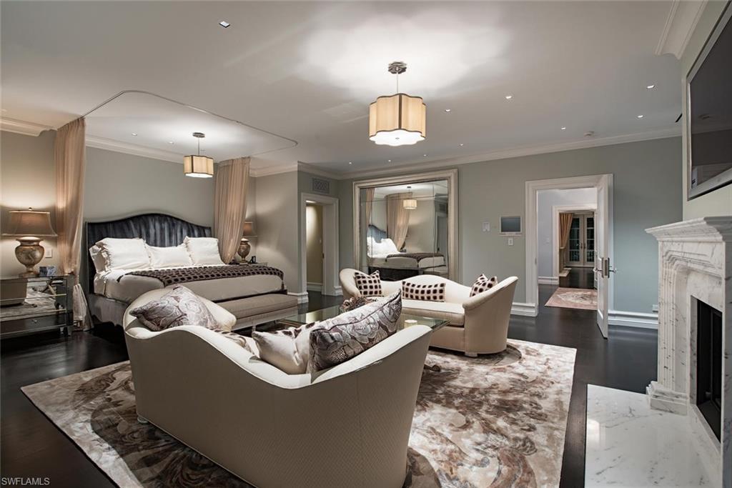 2500 Gordon Drive Naples, FL 34102 - Photo 16 of 25 a living room with furniture and a chandelier