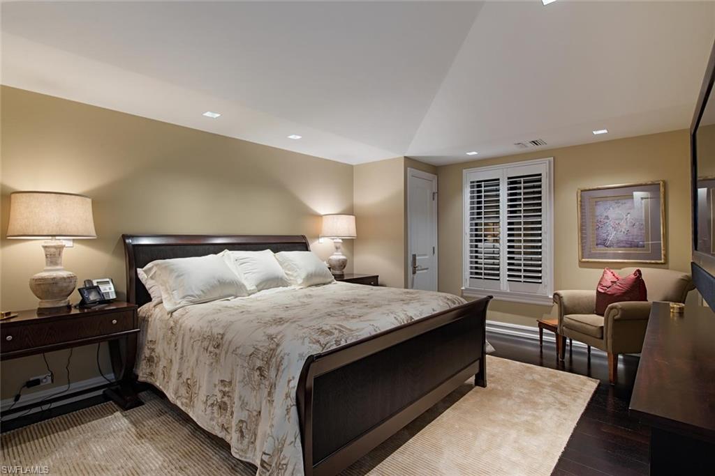 2500 Gordon Drive Naples, FL 34102 - Photo 20 of 25 a bedroom with a bed and a couch