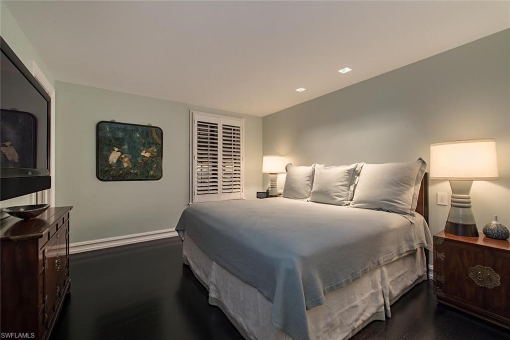 2500 Gordon Drive Naples, FL 34102 - Photo 21 of 25 a bedroom with a bed and a flat screen tv