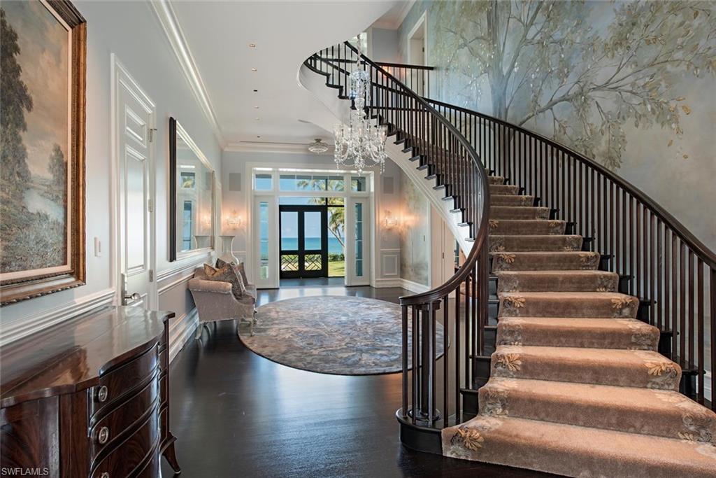 2500 Gordon Drive Naples, FL 34102 - Photo 7 of 25 a view of entryway and hall with wooden floor