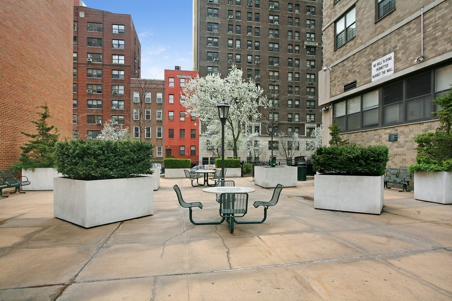 301 East 79th Street, Unit 5P Manhattan, NY 10075 - Photo 13 of 16 a building outdoor space with patio furniture and potted plants