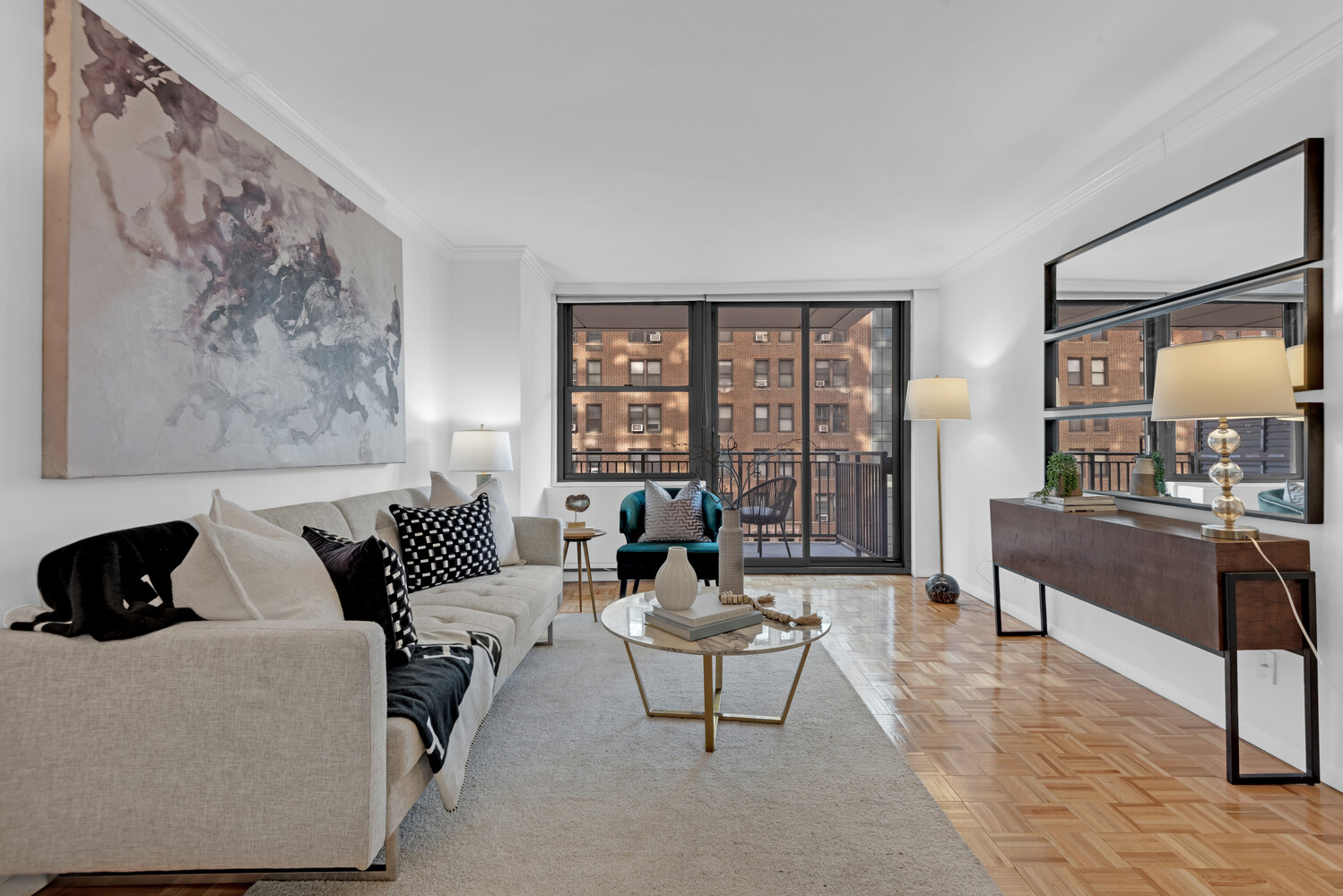 301 East 79th Street, Unit 5P Manhattan, NY 10075 - Photo 3 of 16 a living room with furniture and a large window