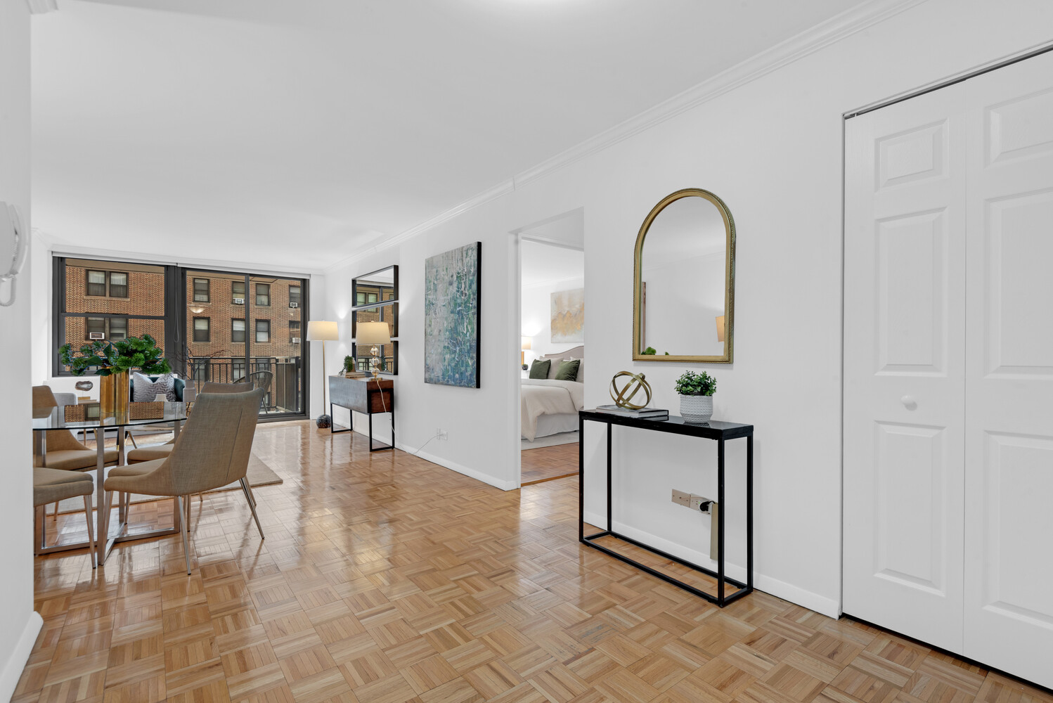 301 East 79th Street, Unit 5P Manhattan, NY 10075 - Photo 5 of 16 a living room with furniture a dining table and a potted plant
