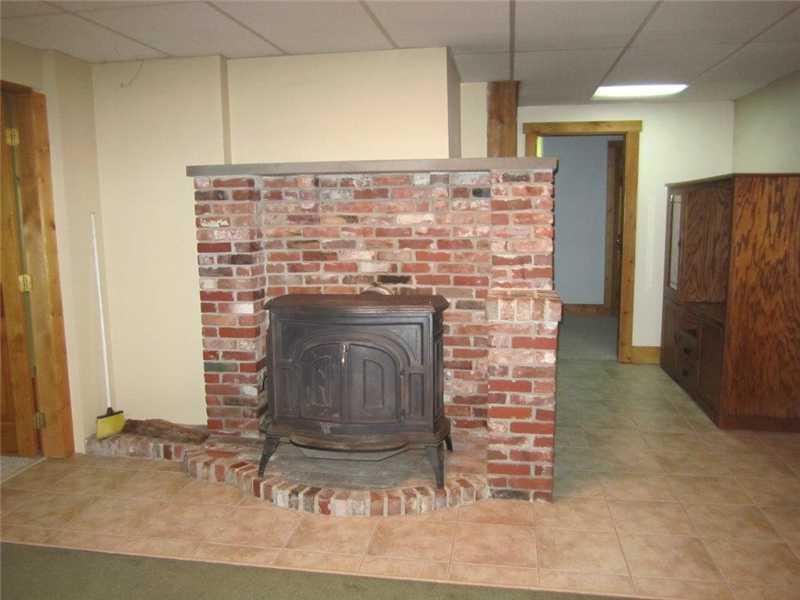 356 Ford Quint Road North Berwick, ME 03906 - Photo 18 of 35 Finished Basement. hearth in basement