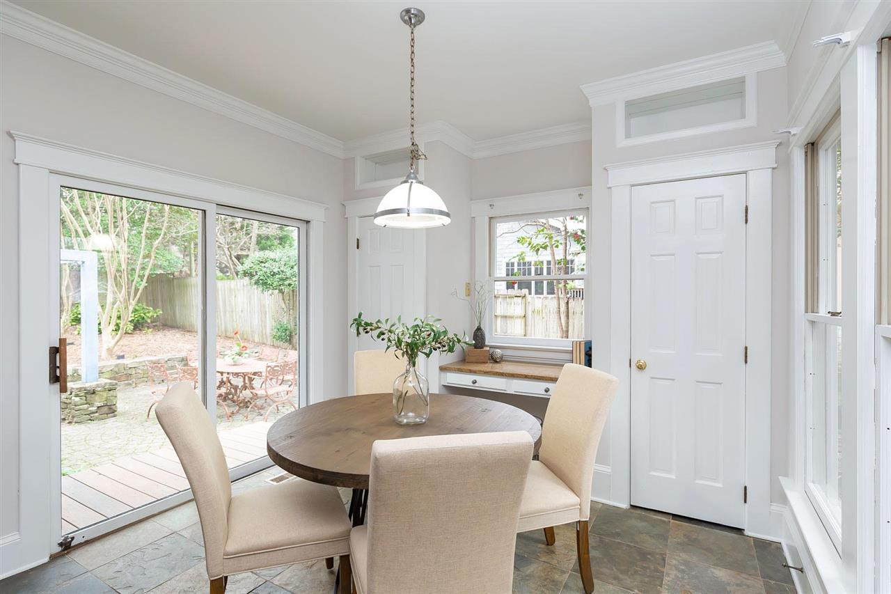 2119 Cowper Drive Raleigh, NC 27608 - Photo 10 of 30 Sunny Bfast area w/2 pantry closets, built in desk, wine racks, and sliders to Patio Breakfast Nook