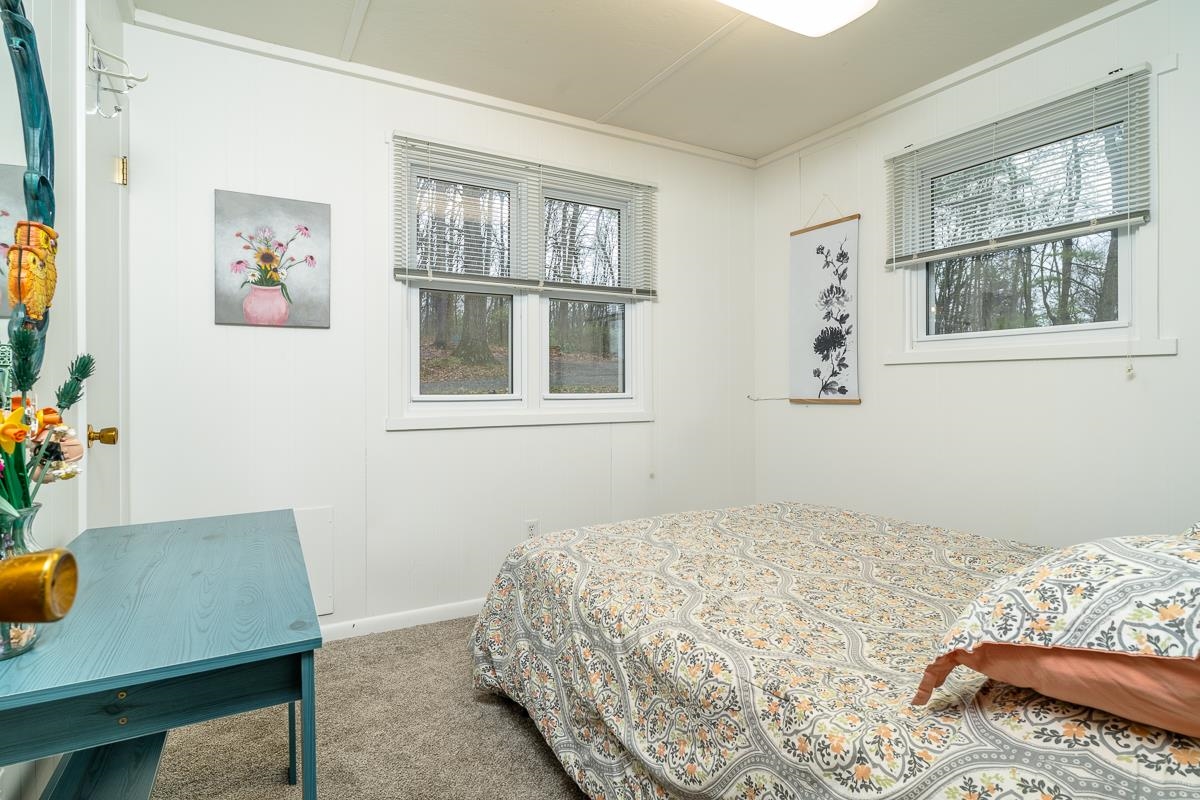 188 New Market Reservoir Road New Market, VA 22844 - Photo 19 of 61 a bedroom with bed and a window