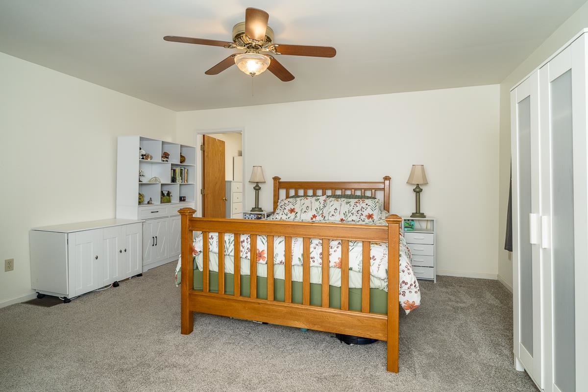 188 New Market Reservoir Road New Market, VA 22844 - Photo 10 of 61 a bedroom with a bed and a chandelier