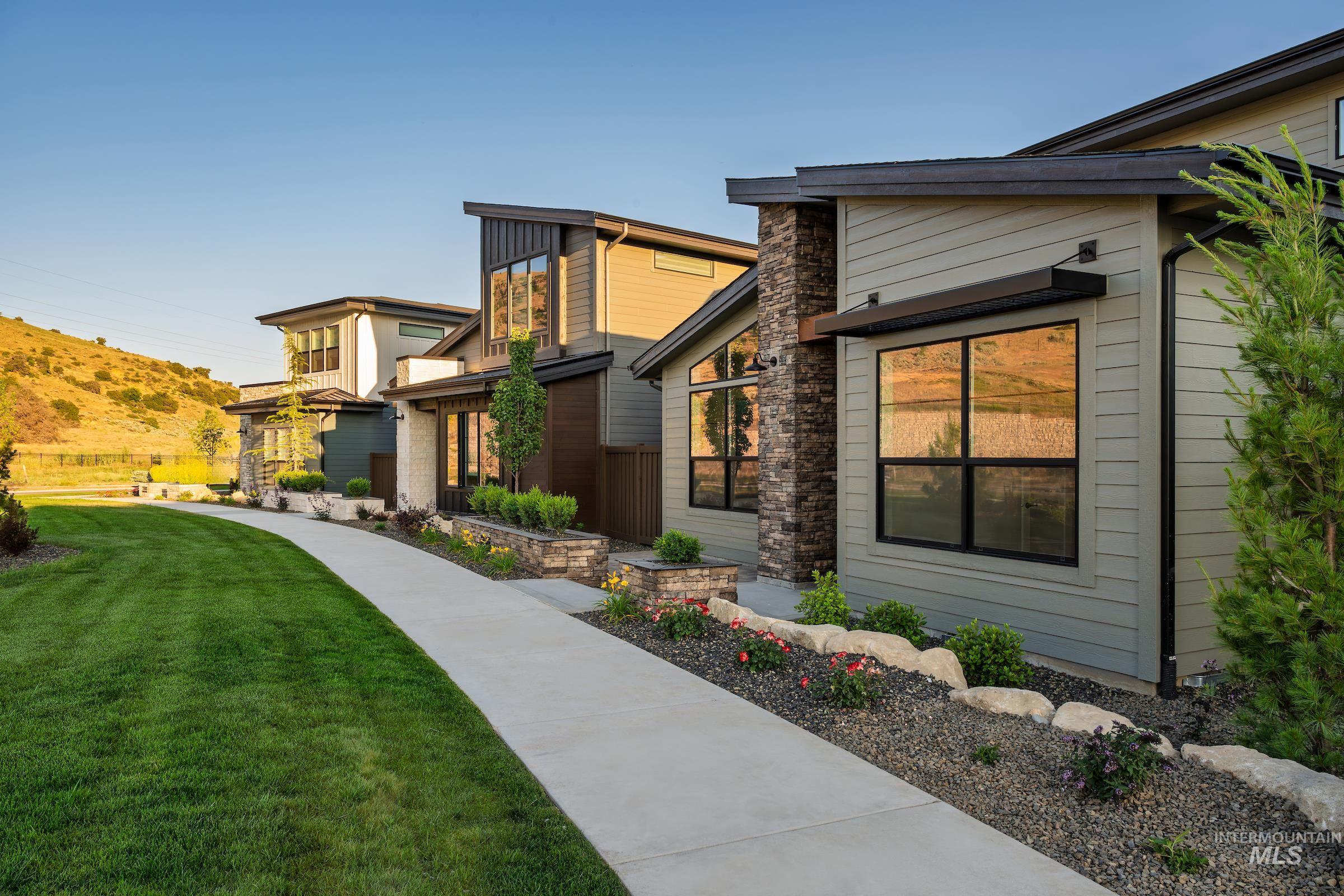 11733 North Rabbitbrush Way Boise, ID 83714 - Photo 31 of 31 View of side of property featuring a yard and a balcony