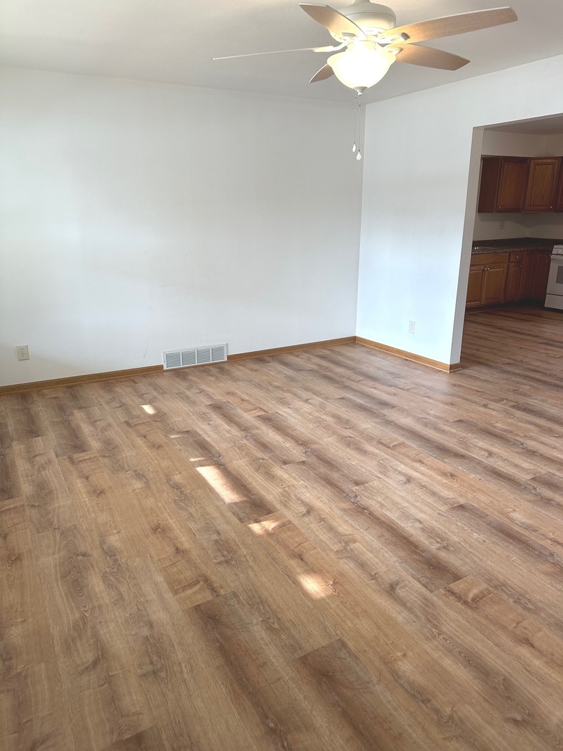 249 West Nebraska Street Frankfort, IL 60423 - Photo 4 of 18 a view of empty room with wooden floor