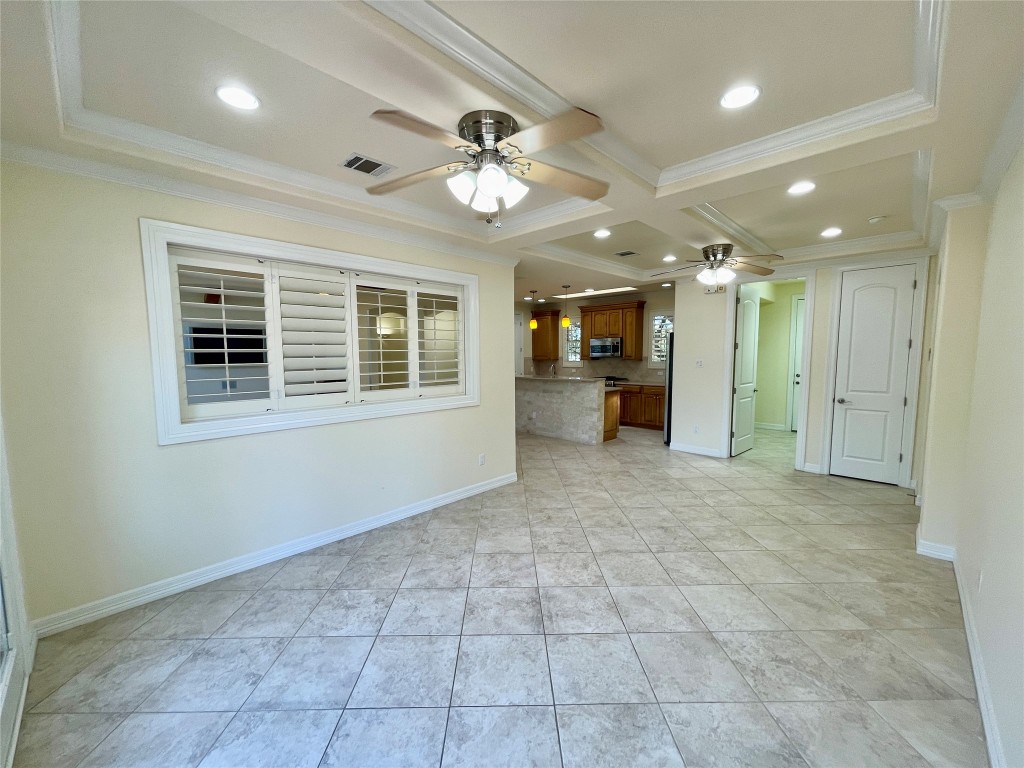 20603 Highland Lake Loop Lago Vista, TX 78645 - Photo 11 of 37 a view of a livingroom with a chandelier fan and windows