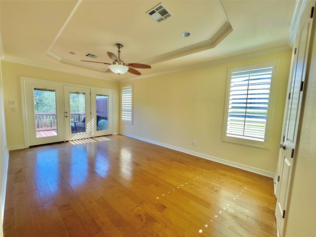 20603 Highland Lake Loop Lago Vista, TX 78645 - Photo 12 of 37 a view of an empty room with window and wooden floor