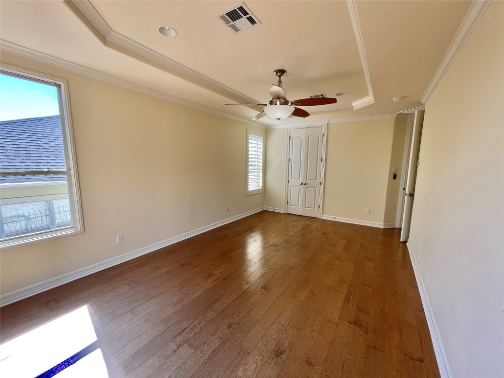 20603 Highland Lake Loop Lago Vista, TX 78645 - Photo 13 of 37 an empty room with wooden floor and windows