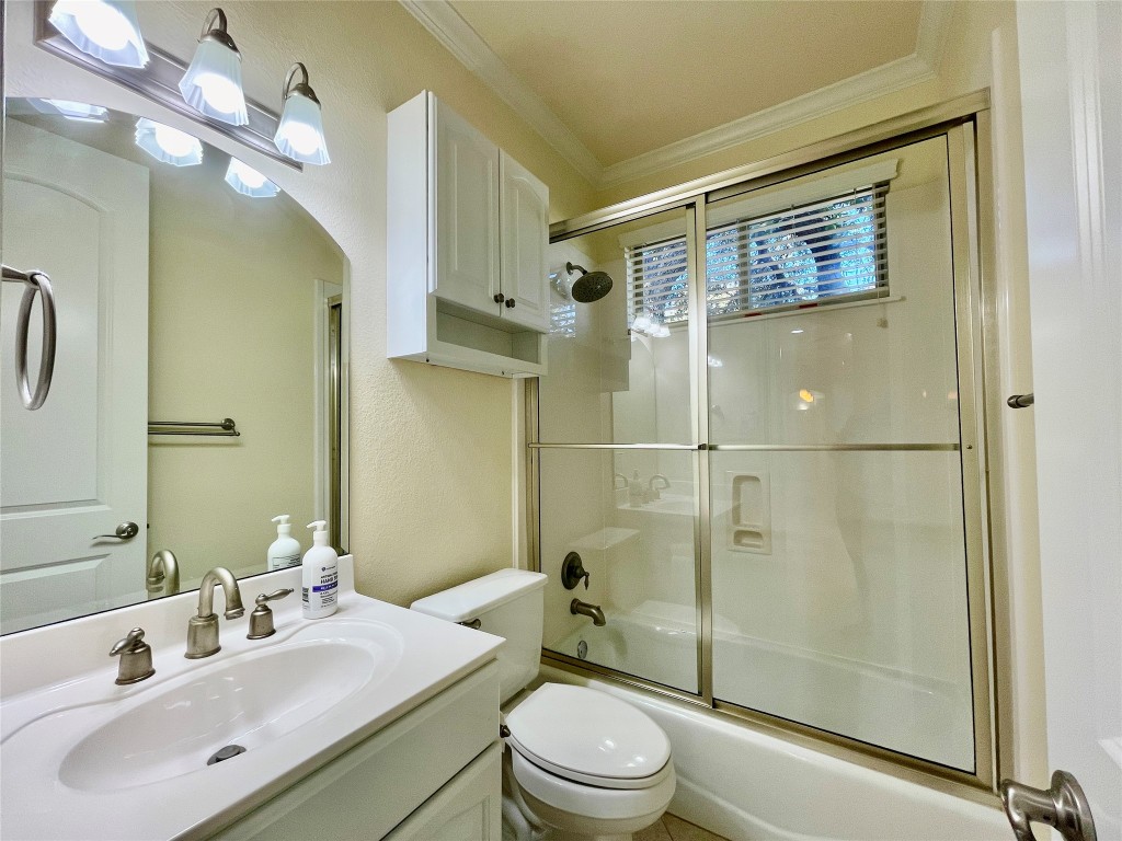 20603 Highland Lake Loop Lago Vista, TX 78645 - Photo 22 of 37 a bathroom with a sink a toilet and shower